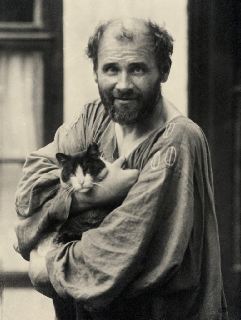 Portrait of artist Gustav Klimt holding a cat