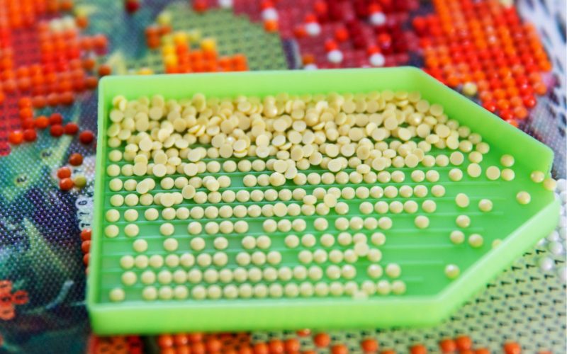 Diamond Painting 101: Image of plastic tray with round resin drills
