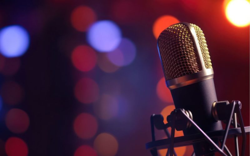 International Podcast Day: microphone with colorful bokeh background